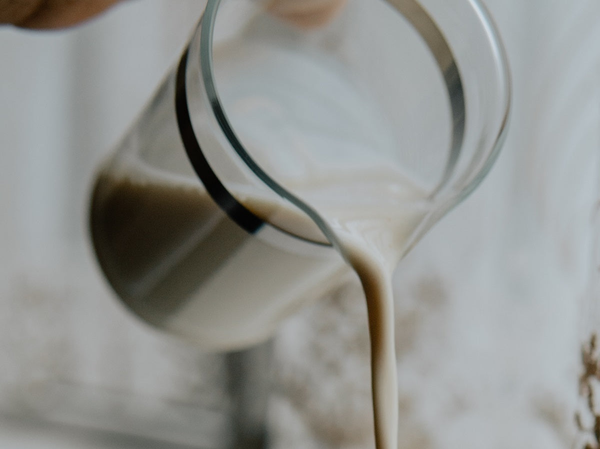 milk pouring out of a pitcher